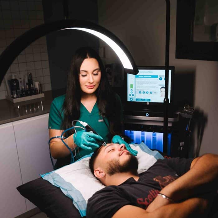 Client receiving skin needling treatment at a cosmetic clinic Parramatta to improve texture and tone.