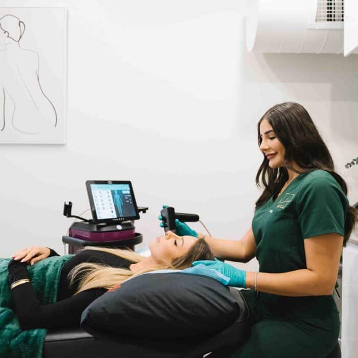 Woman receiving professional hydrafacial therapy at a cosmetic clinic in Parramatta.