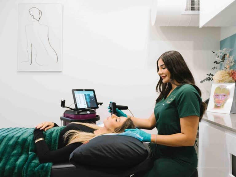 Woman receiving professional hydrafacial therapy at a cosmetic clinic in Parramatta.