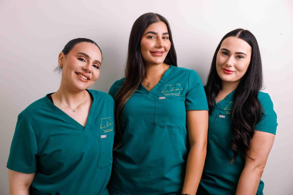 Group of cosmetic clinic staff in uniform.