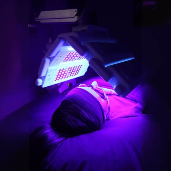 Client receiving blue light LED therapy at Biba Cosmetic Solutions.