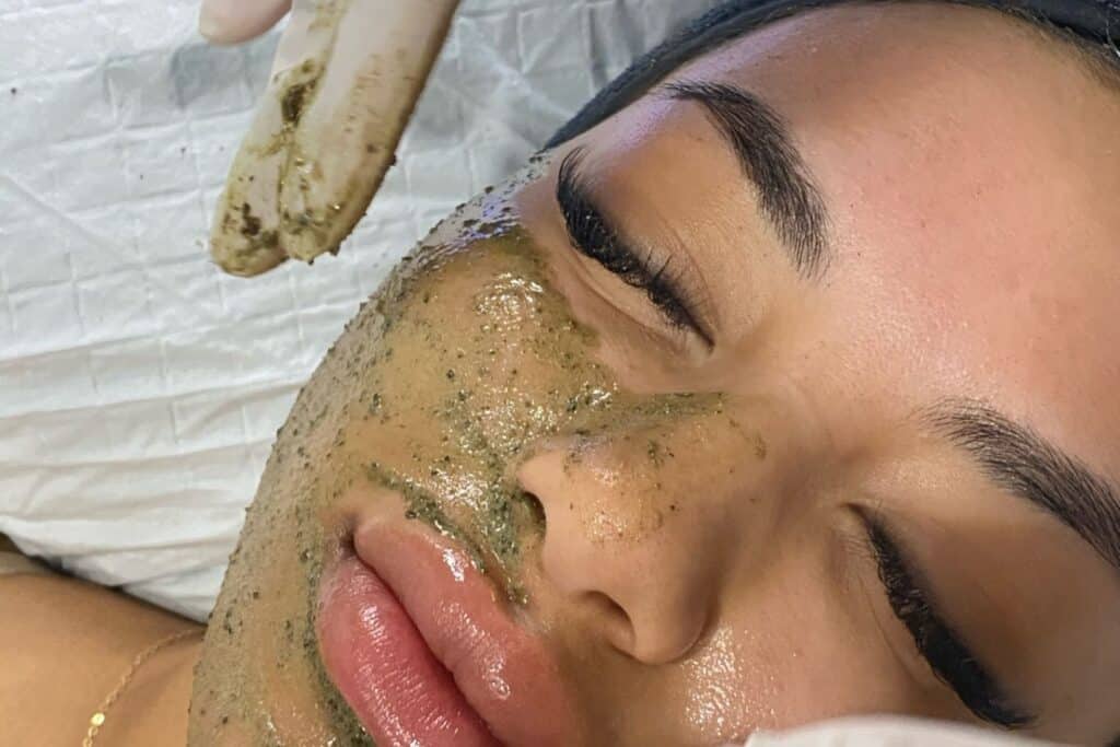 An in-treatment shot of a client having a chemical peel applied, part of a professional exfoliation process to renew the skin.