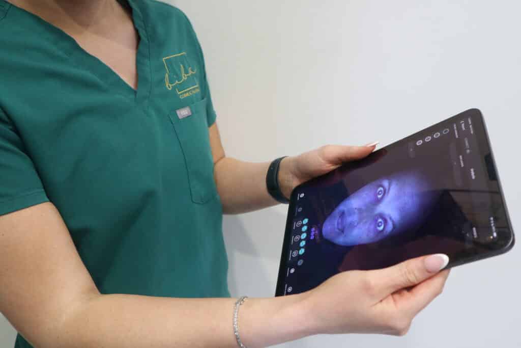 A detailed OBSERV skin scan displayed on an iPad screen, showing the results of an in-depth skin analysis performed at a skin care clinic.