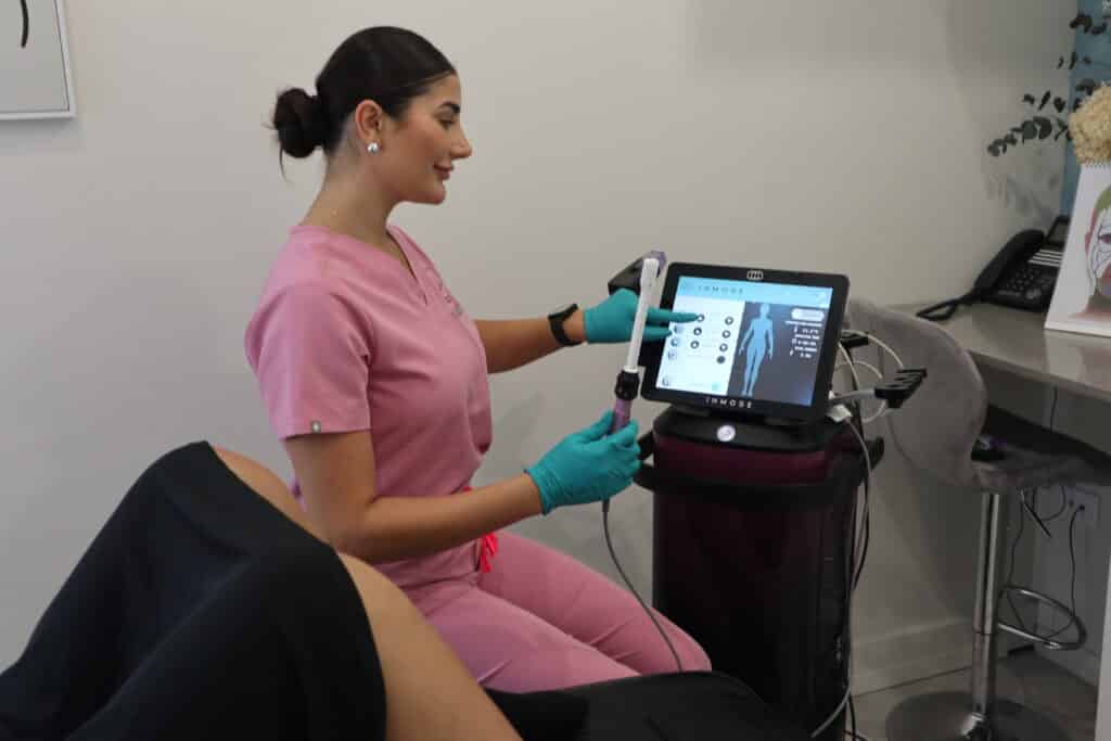 Nurse performing a vaginal tightening procedure using the EmpowerRF device, delivering advanced energy-based treatment in a clinical environment.