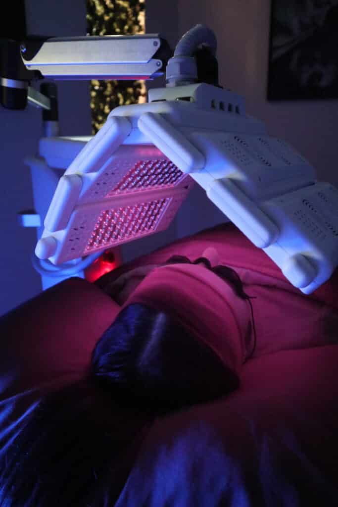 Infrared light being gently applied during a targeted skin treatment session to support tissue repair and improve skin texture.