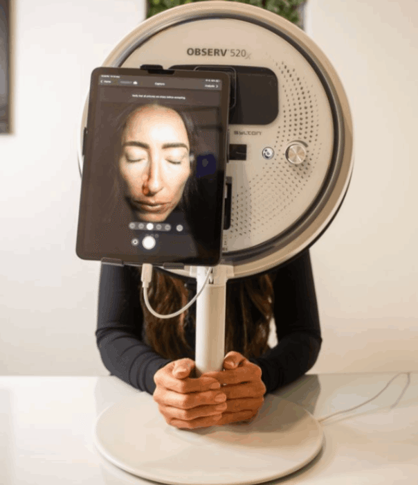 Client getting their face scanned in our new ObserV machine